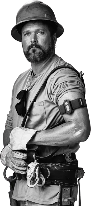 Worker in a hard hat and tool belt wearing an Epicore armband on the upper arm